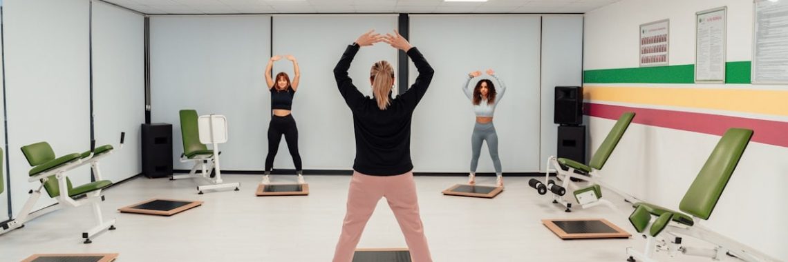 a group of people doing exercises in a room